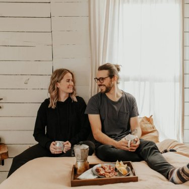 A couple enjoys breakfast at Wren's Hollow – Townhomes in Pooler, GA.
